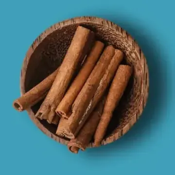 Cinnamon sticks in a wooden bowl